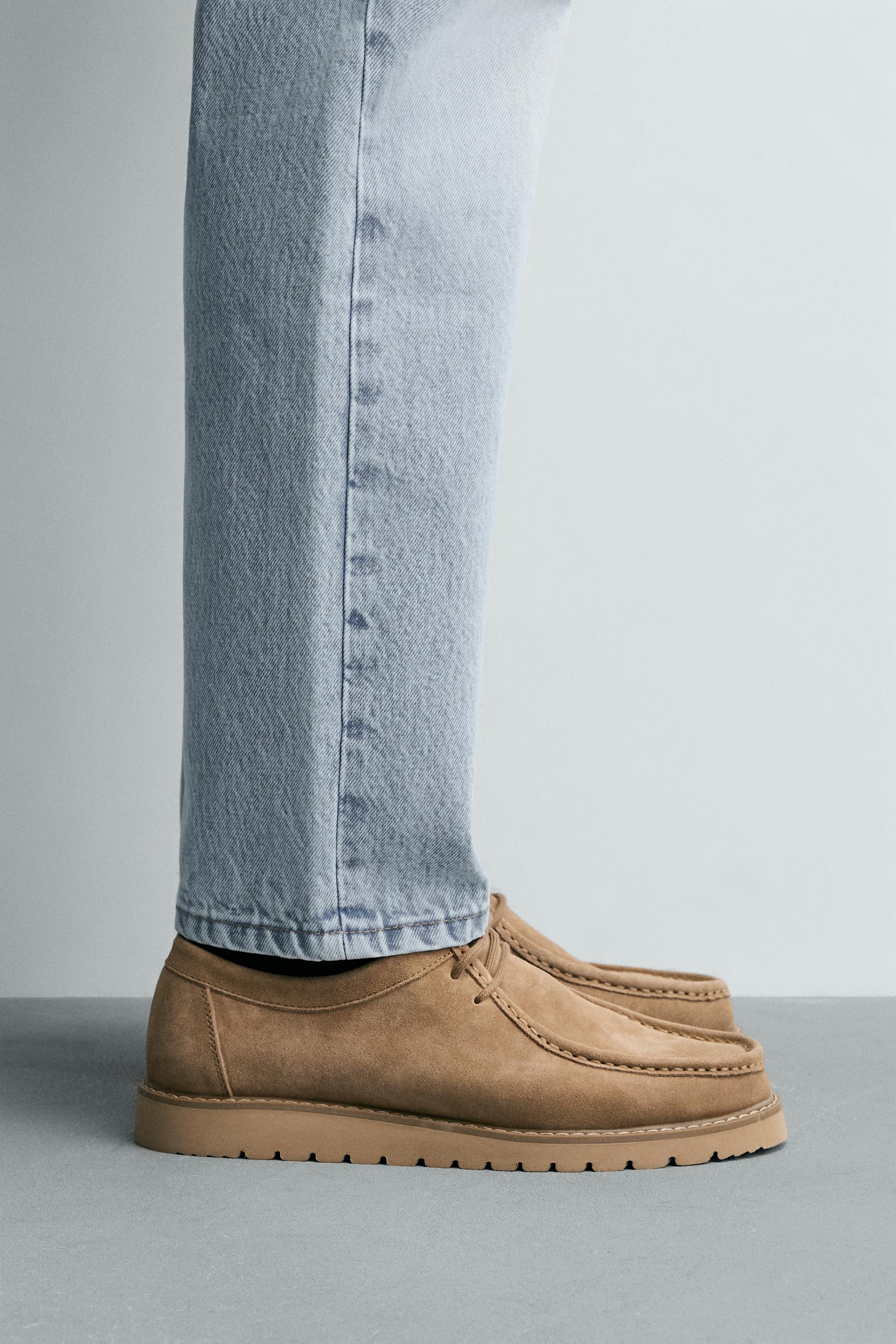 CHAUSSURES EN CUIR BORDÉES